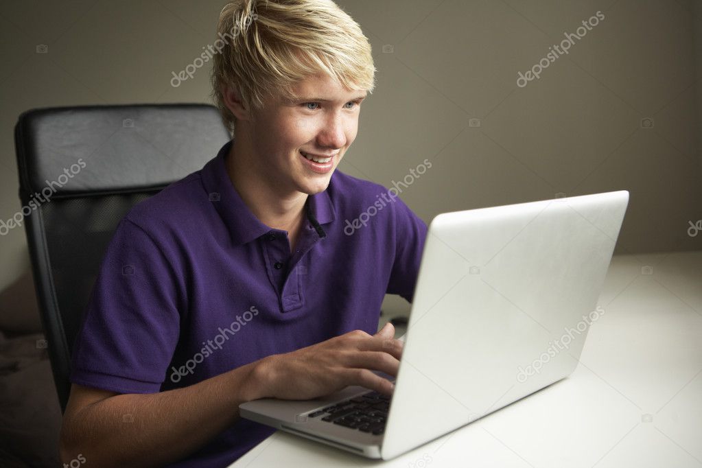 depositphotos 11880127 stock photo teenage boy using laptop at