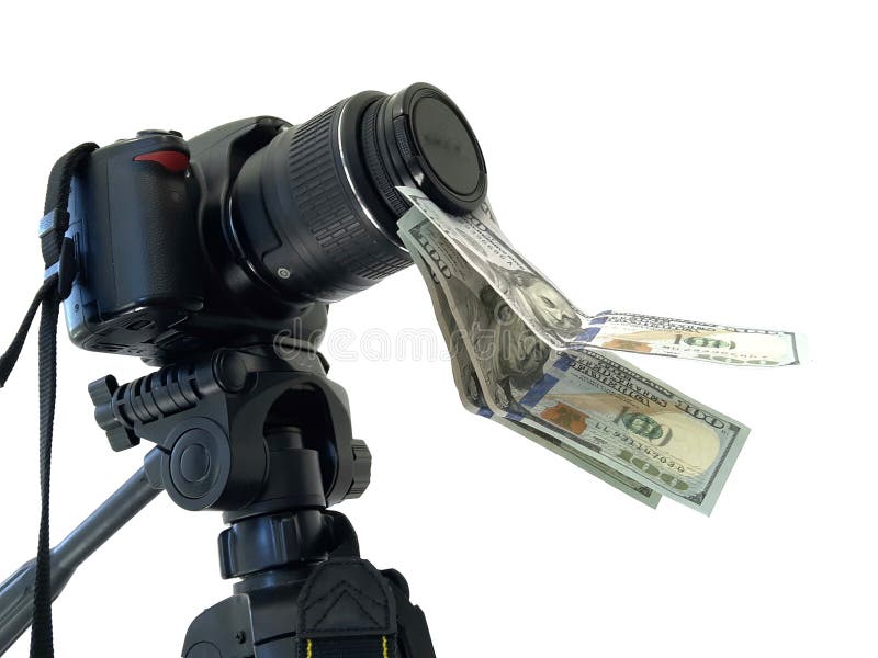 Camera and money, earnings for photographs. On photobanks royalty free stock photography