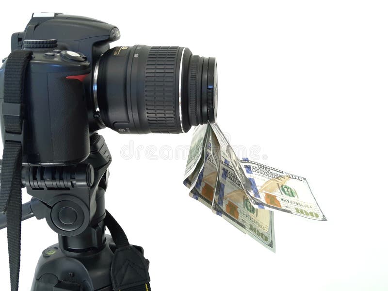 Camera and money, earnings for photographs. On photobanks stock photo