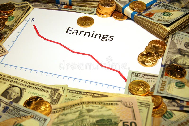 Chart of earnings falling down with money and gold. Chart of earnings falling down surrounded by money and gold royalty free stock photo