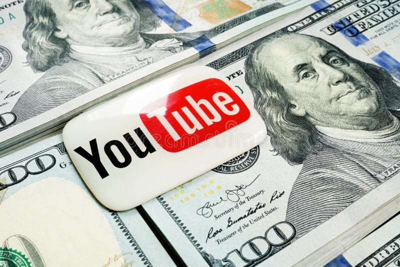 Kyiv, Ukraine - July 30, 2020: YouTube logo lies on the wads of money. Earnings by video blogging. Kyiv, Ukraine - July 30, 2020: YouTube logo lies on the stack royalty free stock photos