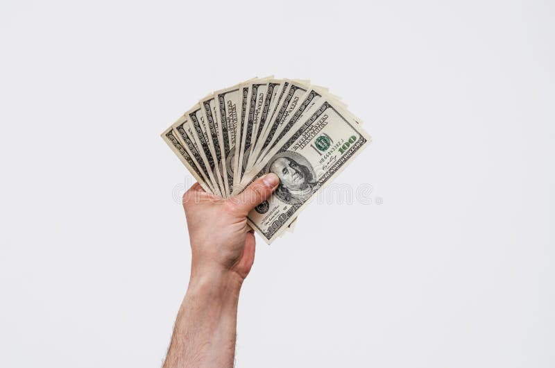 Man hand holds american dollars money. On black background. Finance, earnings, crediting.  royalty free stock photography