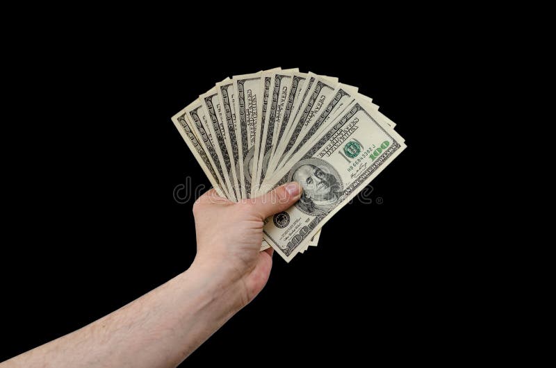 Man hand holds american dollars money. On black background. Finance, earnings, crediting.  stock image