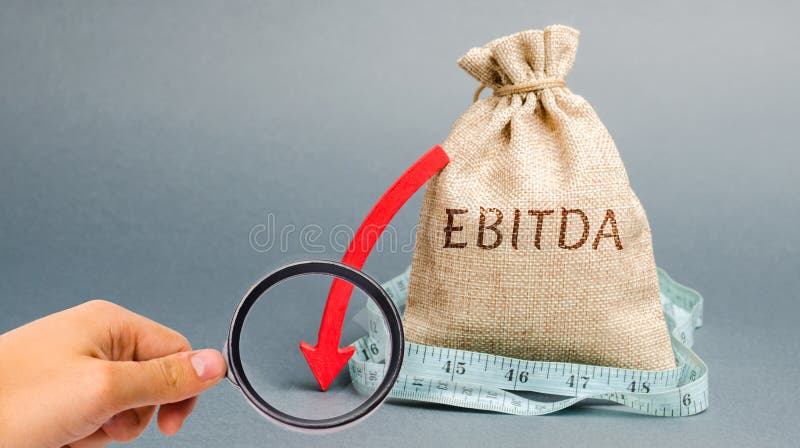 Money bag with the word Ebitda and down arrow. Earnings before interest, taxes, depreciation and amortization. Problems with. Business profitability and cash stock images