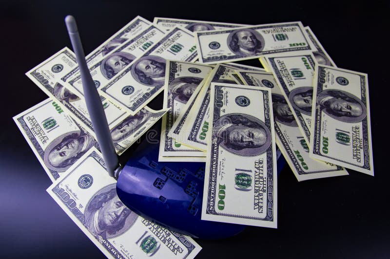 Money on the Internet router - Internet earnings. American dollar. Background stock photos